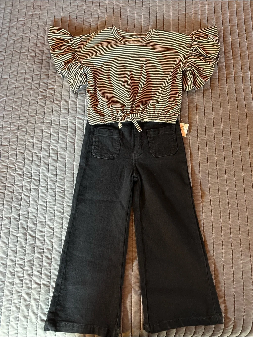 Jessica Simpson Black & Cream Striped Knit Top & black jeans
